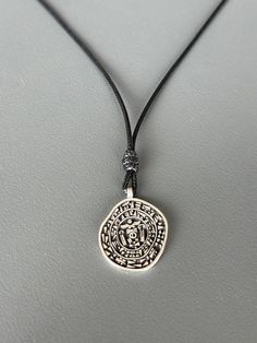 The Hittite royal seal was a privileged item belonging to kings, queens, and sometimes princes, representing the power and strength of its owner. The symbols formed in the hieroglyphs and cuneiform writings on the seal represent health and long life. All our artisan crafted products are made from 925 sterling silver which requires polishing from time to time from oxidation. You can quickly restore silver to shine with a polishing cloth Please; Avoid contact with cosmetics and chemicals. Don't wear it in the shower, pool, spa, or the beach. Stamp Necklace, Amulet Charm, Stamped Necklaces, Artisan Craft, Locket Necklace, Long Life, Charm Pendant, Locket, Silver Necklace