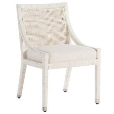 a white chair with wicker back and armrests