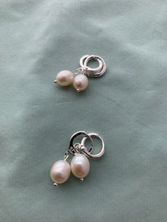 "Creamy light creamy white, natural 1) Very Small or 2) Small teardrop oval real pearls and mounted on lovely period appropriate loops in 16k gold or silver plated brass loops: great soft close, stay on well and great for sensitive ears (lead free, nickel free). These small real pearl earrings were inspired by the pair that British royalty wear on a regular basis! THIS LISTING is a CUSTOMER FAVORITE! MEASUREMENTS: Earrings measure about 1\" long VERY SMALL: 7.2 X 8.3mm pearl SMALL: 7.8 X 10.3mm Cream Pearl Drop Jewelry, Cream Pearl Drop Jewelry For Anniversary, Oval Pearl Drop Hoop Earrings Gift, Cream Teardrop Pearl Drop Jewelry, Clip-on Teardrop Pearl Jewelry, Teardrop Pearl Clip-on Earrings, Teardrop Pearl Clip-on Jewelry, Pearl White Clip-on Earrings With Pearl Drop For Gift, Hypoallergenic Pearl Teardrop Hoop Earrings