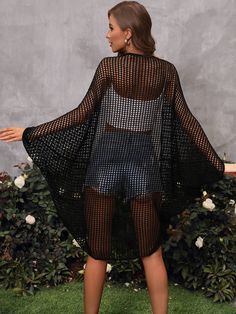 This MADRID KNIT CROCHET KIMONO is like wearing a sea hug! Crafted from soft knit crochet fabric, this black kimono drapes around you like a cool embrace! Slip it on for a stylish look that always feels oh-so-cool! Size Guide: Pryscila is 5’6” tall, and has a 33.5” bust, 24.8”waist, & 37.4” hips. She is wearing a S / US 4 / AU 8. This kimono is true to size. Material: 100% Acrylic. Key Features: Relaxed fit. Open Front. Crochet Knit Fabrication. Maternity Friendly. Care Instructions: Machine was Black Spring Festival Cover-up, Casual Black V-neck Kimono, Black Bohemian Kimono For Beach Cover-up, Black Stretch Casual Cover-up, Black Stretch Cover-up For Spring, Black Stretch Spring Cover-up, Casual Black Stretch Cover-up, Black V-neck Cardigan For Vacation, Black Stretch Knit Cardigan