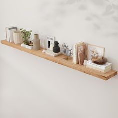 a shelf with books, vases and other items on it