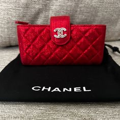 Authentic Chanel Red Metallic Leather Phone Case Holder New With Out Tags Small Mark Inside Case Only Luxury Red Rectangular Clutch, Elegant Red Clutch With Dust Bag, Designer Red Clutch For Gift, Designer Red Clutch As Gift, Red Clutch Wallet For Formal Occasions, Red Formal Clutch Wallet, Chic Red Evening Wallet, Designer Red Rectangular Wallet, Luxury Red Rectangular Wallet