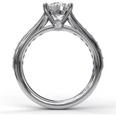 a white gold engagement ring with a diamond center