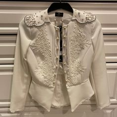 Stunning White Jacket. Size 42 (Italy). Fits Like A Small Brand New. Never Worn Elegant White Embellished Blazer, Designer White Evening Blazer, Chic Tailored Embellished Outerwear, Embellished White Blazer, White Embellished Long-sleeved Blazer, White Embellished Winter Outerwear, Tailored Embellished Outerwear, Tailored Long Sleeve Embellished Outerwear, Fitted White Embellished Outerwear