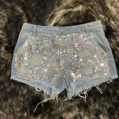 Light Wash Denim Distressed Shorts With Silver Sequins Size Small (Runs From 2-4) Never Worn Stretch Denim Jean Shorts For Night Out, Party Cutoff Denim Shorts, Blue Denim Sequined Bottoms, Trendy Sequined Bottoms For Summer, Casual Spring Sequin Shorts, Trendy Sequined Summer Bottoms, Short Denim Jeans For Party, Denim Party Shorts, Short Denim Party Jeans