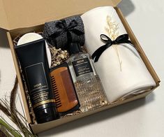 an open gift box containing personal care items