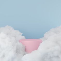 a pink vase surrounded by white clouds on a blue background