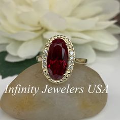 This ring is an elongated oval lab created ruby with halo diamond design, 14k yellow gold #6220 Instagram https://www.instagram.com/p/BxdTrhJgi8B/?utm_source=ig_share_sheet&igshid=rvwra47lnj4f We feature the finest quality lab grown rubies in the world. The properties of lab-grown are physically, chemically and visually identical to natural, just grown in a lab setting. -Approximate total carat weight: 5.10ctw diamond equivalent -Center Stone Size: approx. 5.00ct diamond equivalent -Center S Oval Lab-created Ruby Fine Jewelry For Wedding, Oval Lab-created Ruby Wedding Jewelry, Formal Oval Lab-created Ruby Jewelry For Weddings, Oval Lab-created Ruby Ring With Center Stone, Oval Lab-created Ruby Ring For Anniversary, Oval Ruby Halo Ring For Formal Occasions, Oval Ruby Ring With Accent Stones For Anniversary, Oval Ruby Ring For Anniversary, Oval Lab-created Ruby Jewelry For Anniversary