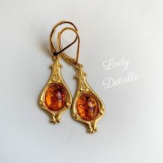 "Tiny AMBER Edwardian Earrings, Baltic Amber and Gold Edwardian Design in 16k gold plated lever backs early 20th reproduction gold earrings This listing is for a pair of reproduction early 20th century EDWARDIAN design earrings, created with gorgeous real Baltic AMBER with a historic and classical design, finished with 16K gold plated brass Lever backs. I simply adore this classic long Edwardian design: perfect for Edwardian, Titanic and Downton Abbey, as well as Victorian styling, versatile and Gold Brass Earrings Perfect As A Gift, Gold Nickel-free Earrings For Gift, Gold Pierced Earrings For Gift, Gold Jewelry With Ear Wire For Anniversary, Elegant Antique Gold Round Earrings, Gold Nickel-free Earrings For Wedding, Victorian Style Gold-plated Jewelry, Vintage Gold Sterling Silver Clip-on Earrings, Heirloom Style Gold Plated Jewelry