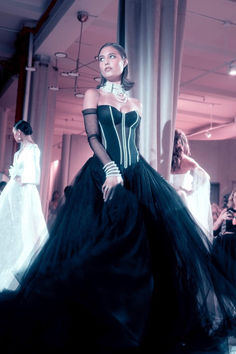 Embrace the drama in this black ball gown extravaganza. A symphony of elegance unfolds as a dramatic, pearl-studded boned sheer corset takes center stage, adorned with opulence. The corset's intricate design is paired with an opulent black tulle skirt, creating an ethereal dance of textures. Black Tulle Skirt, Black Ball Gown, Sheer Corset, Tulle Skirt Black, Galia Lahav, Black Bridal, Tulle Ball Gown, Black Tulle, Black Wedding Dresses