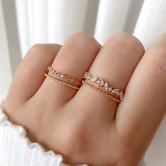 This lovely ring centers on an eye-catching round crystal, finished with marquise crystals and a beaded pattern band. Type: Adjustable ring (approx. size 6) Main material: Rose Gold, Rhodium, 16k Gold Plated on Brass,  Cubic Zirconia Need some jewelry inspiration? Follow us on Instagram  @statementGrey Fine Jeweled Rings, Adjustable Sparkling Rings For Wedding, Dainty Round Rhinestone Jewelry, Fine Jewelry Wedding Ring With Rhinestones, Adjustable Crystal Gold Rings, Crystal Rhinestone Promise Ring, Dainty Sparkling Promise Ring, Fine Crystal Ring With Sparkling Stones, Wedding Rings With Rhinestones