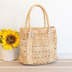 IN STOCK FAST SHIPPING FROM LOS ANGELES Add some coastal charm to your summer look with Elena Handbags Raffia Beach Bag. This shoulder bag is made from natural raffia, complete with a playful shell decoration. Perfect for a day at the beach or a casual outing, it's the must-have accessory for any summer adventure! Natural Soft Raffia Straw Handmade Size: 11"H x 13"W x 6"D Strap drop length: 7" Designer Style ID: 8706 Natural Crochet Bag For Vacation, Palm Leaf Crochet Bucket Bag For Vacation, Natural Palm Leaf Crochet Bag For Vacation, Eco-friendly Open Weave Shoulder Bag For Beach, Natural Open Weave Shoulder Bag For Beach, Beachy Natural Shoulder Bag For The Beach, Beach Shoulder Bag With Open Weave In Natural Color, Natural Palm Leaf Beach Bag For Vacation, Bohemian Palm Leaf Shoulder Bag For Beach