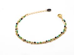 Delicate, minimalist bracelet, composed of 2 rows of fine chains: - a chain gilded with fine gold (1 micron) decorated with small beads - and a chain decorated with tiny Miyuki glass beads in delicate colors (brown, green, beige, turquoise, gold...). The beads measure 1mm, which gives the bracelet a very light appearance. The bracelet has a 3 cm extension chain, finished with a small black enameled sequin. This bracelet is adaptable to wrists between 15-18 cm. (other dimensions possible on reque The Vivienne, Small Beads, Gift For Woman, Colors Brown, Minimalist Bracelet, Green Beige, Bracelet Collection, Ankle Bracelets, Black Enamel