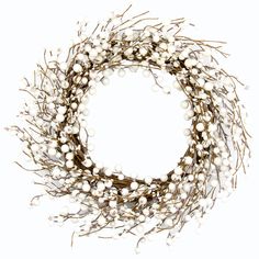 a close up of a wreath made out of white balls and twigs on a white background