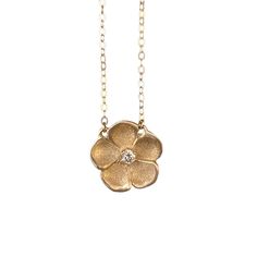 Inspired by a Victorian genre of jewelry, our forget-me-not necklace is handmade in textured metal with a dazzling accent stone in the center. The "name forget-me-not" comes from a German legend of a knight who died trying to obtain these flowers for his lover, calling out with his last breath, "forget me not!" They are therefore known to symbolize true love. Handcrafted in Sterling silver or 14k gold Set with one approx. 2mm stone (opal, ruby, or diamond) Set on a 16" chain, fastened with a sec Gold Gemstone Necklaces With Flower Design, Wedding Jewelry With Flower Charm In Brass, 14k Gold Silver Necklace With Flower Charm, Silver 14k Gold Necklace With Flower Charm, Wedding Brass Jewelry With Flower Charm, Delicate Hand Forged Jewelry, Hammered Diamond Jewelry As Gift, Nature-inspired Gold Diamond Jewelry, Nature-inspired Flower Necklace For Anniversary