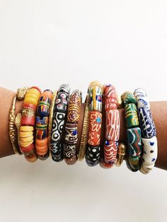 Beautiful, stylish African bracelets handmade from glass by artisans in Ghana. They come in a variety of unique color combinations and patterns, the more you wear, the better. Sizes:Wide-1/2”W Each bracelet is one of a kind and fits wrist size 6-7. Available as a single bracelet or set of 3. Each bracelet is one-of-a-kind and may vary slightly but will be similar to the bracelets pictured. Multiple bracelets are pictured to show variation, however each bracelet is sold individually. African Bracelets, Single Bracelet, Multiple Bracelets, Unique Color Combinations, Locs, Ghana, Handmade Bracelets, Color Combinations, Size 6