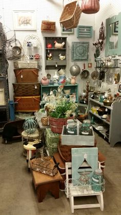 a room filled with lots of furniture and baskets