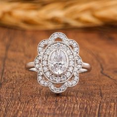 a diamond ring on top of a wooden table