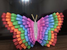 a colorful butterfly made out of sticky notes