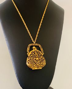 This decorative gold plated 2 inch tall and 1 5/8 inch wide hinged purse pendant has a beautiful decorative pattern. The sturdy decorative long rope chain is 23 inches long. This would be a great holder for essential oil on cotton. This is sturdy and bright and well made. I specialize in finding fun wearable jewelry. Please browse my shop for more options. I have a large necklace section in my shop. Wearable Jewelry, Wire Cuff, Long Rope, Large Necklace, Decorative Pattern, Copper Bracelet, Bright Gold, Rope Chain, Vintage Necklace