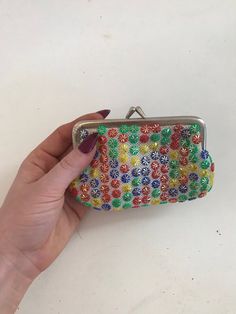 Vintage multicolored coin purse with bright colored floral beads. Metal coin purse clasp. Handmade Multicolor Clutch Coin Purse, Retro Multicolor Coin Purse As Gift, Vintage Multicolor Rectangular Coin Purse, Multicolor Beaded Clutch, Everyday Multicolor Beaded Coin Purse, Vintage Multicolor Coin Purse As Gift, Vintage Multicolor Coin Purse For Gift, Retro Multicolor Wallets As Gifts, Multicolor Beaded Pouch Coin Purse