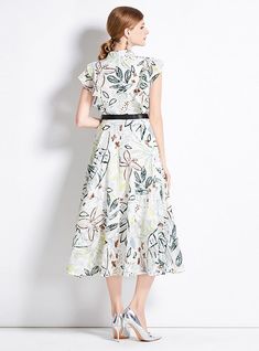 Blossoming with the serene elegance of a garden in springtime, this cap-sleeve midi dress is a celebration of femininity and grace. Adorned with a delicate botanical print that speaks of nature's effortless beauty, this creation is a symphony of subtle colors and refined design. The addition of a sleek black belt cinches the waist, creating a silhouette that is at once classic and contemporary. The full, airy skirt is designed to swirl around your legs as you move, a dance of fabric that enhance Green Printed Dress, Belt Making, Modest Neckline, Sleeveless Dresses Casual, Effortless Beauty, Full Length Skirts, Black Knit Dress, White Belt, Embroidered Skirt