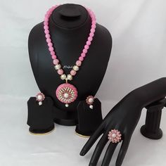 Indian fashion Jaipuri pearl, pachi moti bridal mala haar necklace set with matching stud earrings and adjustable ring. Handcrafted with pearl and pachi moti. This beautiful necklace earrings set is designed with lot of intricate work. It is perfect match with your formal attire on special occasion or with casual wearing and saree. Main Colour: Gold Pearl Colour: Pink & Ivory Necklace Full Length: 29cm Necklace Closer: Hook Earrings Size: L x 3.5cm / W x 2cm  Earrings Back: Push Back  Ring Size: Kundan Jewelry Sets For Puja, Festive Round Jewelry For Puja, Round Pearl Drop Jewelry For Festivals, Festival Jewelry With Pearl Drop, Bollywood Style Round Jewelry For Puja, Kundan Necklace With Stone Work, Round Pearl Temple Jewelry, Pearl Jewelry Sets For Celebration, Round Pearl Kundan Necklace For Festivals