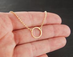 Small gold circle link and gold filled necklace, tiny circle necklace, infinity necklace, simple gold necklace, gold ring A 24 karat over sterling silver round link (12mm) is suspended from a 14 karat gold filled chain that can be up to 22 inches in length. The chain is secured with a 14 karat gold filled clasp. The circle is made of round wire and the other part is flattened wire. Your purchase will arrive in a jewelry box ready for gift giving or as a gift for yourself! Enter my shop here: jer 14k Gold Hoop Jewelry With Adjustable Chain, 14k Gold Filled Jewelry With Adjustable Chain, Hypoallergenic 14k Gold-filled Round Pendant Jewelry, Hypoallergenic 14k Gold Filled Round Pendant Jewelry, Gold Minimalist Open Circle Necklace, Minimalist Gold Open Circle Necklace, Hypoallergenic 14k Gold Filled Round Pendant, Dainty Gold Hoop Necklace, 14k Gold Filled Clavicle Chain With Round Pendant