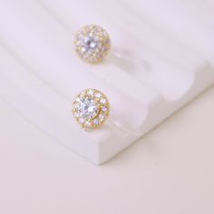 These diamond clip-on studs boast a classic design with classic shapes and cuts to impart timeless elegance. Crafted with zirconia, they make for a magnificent addition. 18k gold-plated with CZ stones SIZE & WEIGHT 7mm long approx. 0.5g per earring approx. No piercings required Sold as a pair Features our signature resin clip for a snug but comfortable fit on your lobe Cz Stone, Clip On Earrings, Round Diamonds, Classic Design, Timeless Elegance, Piercings, Silver Earrings, 18k Gold, Gold Plate