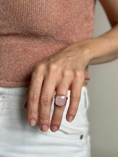 Introducing a radiant masterpiece from Moss Jewellery, behold the Square-cut Rose Quartz and Silver Ring with a captivating rose gold finish. This ring is a harmonious blend of natural elegance and contemporary chic. At its heart lies a generously sized, square-cut natural rose quartz, renowned for its soft, blush-pink tones that evoke a sense of serenity and love. The stone is expertly set in a high-quality silver base, elegantly complemented by a delicate rose gold coating, adding a touch of w Modern Cushion Cut Jewelry For Gift, Modern Pink Gemstone Jewelry, Modern Jewelry For Gift Occasions, Rose Gold Morganite Gemstone Jewelry, Faceted Open Ring Fine Jewelry, Faceted Fine Jewelry Open Ring, Fine Jewelry Faceted Open Ring, Modern Rose Gold Promise Ring Jewelry, Modern Rose Gold Promise Ring