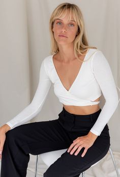 The Wrap Me Up Crop Top features a stretch fabrication with wrap tie body and long sleeves. The perfect basic to pair with our Giselle Trouser. Color: White Wrap Body Long Sleeve 65% Cotton/32% Poly/3% Spandex Model Wearing Size Small and is 32B Bust Fall Must Haves, White Shop, Autumn Summer, Summer Fall, Camisole Top, Cardigans, Color White, Crop Top, Casual Outfits