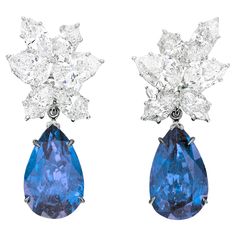 Elevate your jewelry collection with a pair of truly exceptional earrings meticulously crafted to fulfill the distinct preferences of our esteemed client, Louis. These bespoke earrings feature a dazzling duo of 6 Carat Vivid Blue Pear Shape Sapphires, sourced from the enchanting landscapes of Sri Lanka. Luxury Sapphire Earrings Fine Jewelry, Luxury Pear-shaped Diamond Earrings For Evening, Luxury Pear-shaped Diamond Earrings With Gemstones, Luxury Pear-shaped Cluster Earrings For Formal Events, Luxury Pear-shaped Cluster Earrings For Formal Occasions, Luxury Blue Pear-shaped Earrings, Luxury Pear-shaped Cluster Earrings With Brilliant Cut, Luxury Sapphire Diamond Earrings, Luxury Pear-shaped Cluster Earrings With Prong Setting