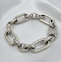 PRODUCT DESCRIPTION Chunky bracelet woman I statement bracelet silver I Bracelet for woman I chunky chain bracelet silver. This chunky and bold silver statement bracelet is a necessary accessory in your daily combination, it's simply chic and resistant with a carabiner closure which creates the perfect look! MEASUREMENT AND SIZE (in the picture) ✦The total length of the bracelet is 7 inches (18cm). choose length from the drop-down menu. ✦Link size is 22mm*15mm MATERIAL Thick silver plating over Chain Link Bracelet Silver, Chunky Silver Bracelet, Bracelet Thick, Silver Link Bracelet, Silver Bracelets For Women, Chunky Bracelet, Chunky Bracelets, Simply Chic, Super Chunky