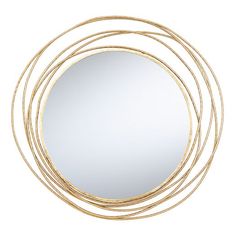 a round mirror sitting on top of a white wall