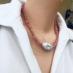 "Add a touch of elegance to your jewelry collection with this stunning Pink Rhodochrosite Chips and large Flat Fresh Water Baroque Pearl Necklace. Handcrafted with love, this exquisite piece features vibrant pink color gemstone chips beautifully complemented by a large fresh water baroque pearl centerpiece. The necklace is further enhanced by shimmering gold filled beads and a secure closure. Perfect for any occasion, this unique necklace will make a thoughtful and unforgettable gift for her. With a length of 18.5 inches, it effortlessly adds a pop of color and sophistication to any outfit. Embrace the beauty and grace of pink opal jewelry with this timeless piece. MATERIALS: Pink Rhodochrosite Freshwater Large Baroque Pearl  Gold filled Measures 47cm or 18.5\"inches All Loulia Pearl Jewel Gift Jewelry With Polished Baroque Pearl Beads, Baroque Pearl Necklaces With Natural Stones For Gifts, Gift Baroque Pearl Necklace With Polished Beads, Baroque Pearl Beaded Necklace With Gemstone Beads For Gift, Gift Necklaces With Polished Beads And Baroque Pearl, Baroque Pearl Necklace With Natural Stones For Gift, Beaded Baroque Pearl Necklace With Gemstone Beads For Gift, Pink Polished Beads Pearl Necklace As A Gift, Gemstone Beads Baroque Pearl Beaded Necklace For Gift