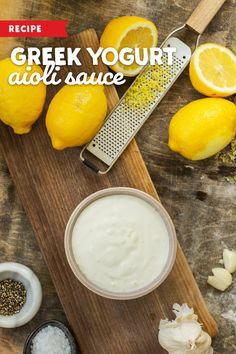 greek yogurt with lemons and garlic on a cutting board next to an onion grater