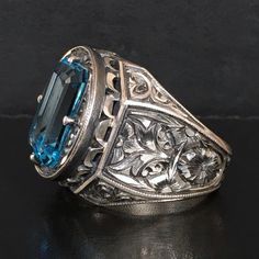 This unique, handcrafted solid silver piece of art is an exquisite one-of-a-kind creation from Turkish artisan jewelers. With its off-handed engravings, it's sure to be a treasured piece of jewelry for years to come. Available in size 10, with worldwide express shipping. Metal: 925 Sterling Silver Gemstone: natural Aquamarine (16x12x10mm) Size: US10 Engraved Ring, Piece Of Art, Natural Aquamarine, Silver Pieces, Engraved Rings, Unique Rings, Artisan Jewelry, Aquamarine, Art Pieces