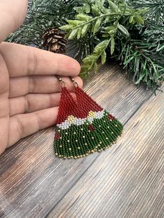 Festive beaded gnome earrings, in red and green classic Christmas colors. It's carefully crafted from premium Czech seedbeads, very lightweight and fun to wear. Handmade Beaded Earrings For Festive Occasions, Festive Handmade Beaded Earrings, Beaded Christmas Earrings Toocutebeads.com, Beaded Elf Earrings, Grinch Earrings Beaded, Christmas Tree Seed Bead Earrings, Earrings Handmade Boho, Beautiful Beaded Jewelry, Silver Star Earrings