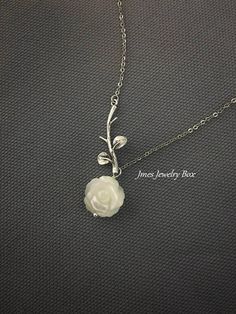 Sweet white shell rose and silver branch necklace. Very dainty but sturdy. White shell rose is double sided and 12mm wide. Silver branch and rose are on an 18'' stainless steel chain with lobster clasp. *Stainless steel chain *Silver brass branch *12mm Shell rose *Handmade with love <3 Like Jmesjewelrybox on Facebook for updates on new jewelry, upcoming sales and giveaways! Plus Facebook fans save 5% :D Find the coupon code on Jmesjewelrybox's cover photo https://www.facebook.com/Jmesjewelryb Silver Dainty Necklace With Rose Design, Dainty Silver Necklace With Rose Design, Dainty Silver Necklaces With Rose Design, Dainty Silver Rose Design Necklaces, Silver Flower-shaped Necklace With Rose Design, Silver Flower Necklace With Rose Design For Gift, Silver Rose Design Flower Necklace As Gift, Silver Rose Design Flower Necklace For Gift, Sterling Silver Rose Design Necklace For Weddings