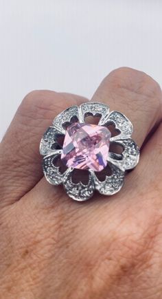 Unusual pale pink ice CZ Deco sterling setting handmade  Size 7 Can be resized. My jeweler charges $20 All rings are shipped in a nice gift box.   Check out our over a THOUSAND great reviews Engraving is $4 per letter and is not always perfect depending on the piece. It can take a few days if the jeweler is busy. This is payable to Paypal Judithsltd@gmail.com Pink Sterling Silver Crystal Ring With Center Stone, Pink Sterling Silver Crystal Ring With Gem, Pink Sterling Silver Crystal Ring For Formal Occasions, Fine Jewelry Pink Ring Stamped 925, Pink Fine Jewelry Ring Stamped 925, Pink Wedding Ring Stamped 925, Pink Sterling Silver Ring With Stone Setting, Sterling Silver Jewelry With Pink Center Stone, Pink Sterling Silver Jewelry With Center Stone