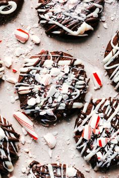 chocolate cookies decorated with candy canes and marshmallows