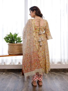 This gorgeous suit set, which includes pants and a chanderi hand block printed chanderi dupatta, is a must-have in your summer wardrobe. It has a flowery round neck hand block printed Anarkali with flared sleeves embellished with Gota. Neck: Boat Neck Sleeve Length: 3/4th Flared Sleeves Kurta Length: Claf Length Fabric: Kurta & Bottom - Cotton Dupatta -Chanderi Note: Wash Care Instructions - Dry Clean Only. The product will be shipped within 15-20 days of the order placed Measurements: Size Bust Semi-stitched Bohemian Kurta With Sheer Dupatta, Bohemian Chanderi Sets With Sheer Dupatta, Bohemian Chanderi Anarkali Set For Eid, Bohemian Anarkali Set With Printed Motifs For Parties, Diwali Cotton Silk Kurta With Floral Print, Bohemian Chanderi Palazzo Set For Eid, Anarkali Palazzo Set With Floral Print And Traditional Drape, Diwali Cotton Silk Floral Print Kurta, Bohemian Cotton Silk Set With Sheer Dupatta