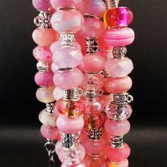 A beautiful handmade snake chain bracelet with a large mix of colorful pink beads, an extender, and a charm of your choice! Great for a gift or yourself. You can only choose either one between the random glitter ball or the random color tree charm Then another two items (normal size) / four items (large size) : dragon (Choose color: silver, gold, bronze, rose) : sword (Choose color: silver, gold, bronze, rose) : random butterfly : random ocean charm : random silver cross : random silver cross Pl Pink Round Beads Charm Bracelet For Friendship, Pink Charm Bracelet With Colorful Round Beads, Pink Charm Bracelet With Round Beads For Friendship, Pink Charm Bracelet With Colorful Beads, Spiritual Pink Spacer Beads, Spiritual Pink Bracelet As Gift, Large Pink Beads For Jewelry Making, Pink Spiritual Crystal Bracelet With Faceted Beads, Handmade Pink Charm Bracelet For Friendship