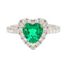 a heart shaped emerald and diamond ring