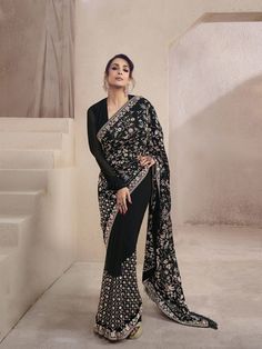 Women Black Floral Multi Thread and Sequins Embroidered Saree with Blouse Piece - Inddus.com Black Chanderi Pre-draped Saree For Reception, Black Embroidered Pre-draped Saree For Navratri, Elegant Embroidered Pre-draped Georgette Saree, Unstitched Black Blouse Piece For Reception, Elegant Embroidered Black Pre-draped Saree, Elegant Black Embroidered Pre-draped Saree, Black Choli With Intricate Embroidery In Georgette, Black Pre-draped Saree With Intricate Embroidery For Designer Wear, Black Unstitched Saree For Reception