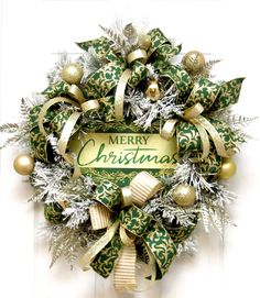 a christmas wreath with green and gold decorations