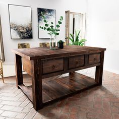 a wooden table with two drawers on one side and a potted plant on the other