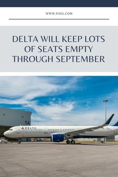 the delta will keep lots of seats empty through sepember on this plane that is parked at an airport