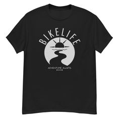 Our classic unisex 100% cotton t-shirt is not only comfortable, but also very on-trend! It ensures a straight line, sits nicely and maintains clean edges, making it perfect for layered streetwear outfits. A must-have in every wardrobe that offers both style and comfort. The front of the shirt features the catchy slogan "BIKELIFE" and a graphic underneath. * Material: 100% cotton * Fabric weight: 170-180 g/m² (5.0-5.3 oz/yd²) Processing: * Open yarn for a soft feel * Tubular fabric for a seamless Biker Style Short Sleeve T-shirt For Streetwear, Motorcycling Short Sleeve Screen Print T-shirt, Black Pre-shrunk Shirt For Outdoor Activities, Sporty Short Sleeve T-shirt For Motorcycling, Sporty Logo Print T-shirt For Outdoor Activities, Biker Events Short Sleeve T-shirt With Front Print, Graphic Tee For Biker Events, Sporty T-shirt With Logo For Outdoor Activities, Outdoor Black T-shirt With Screen Print