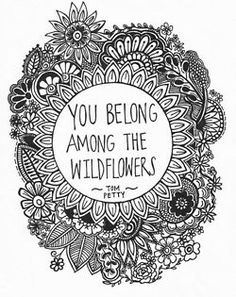 the words you belong among the wildflowers are drawn in black and white